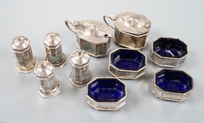 A George V ten piece octagonal silver condiment set, James Dixon & Sons, Birmingham, 1913, with two associated condiment spoons.